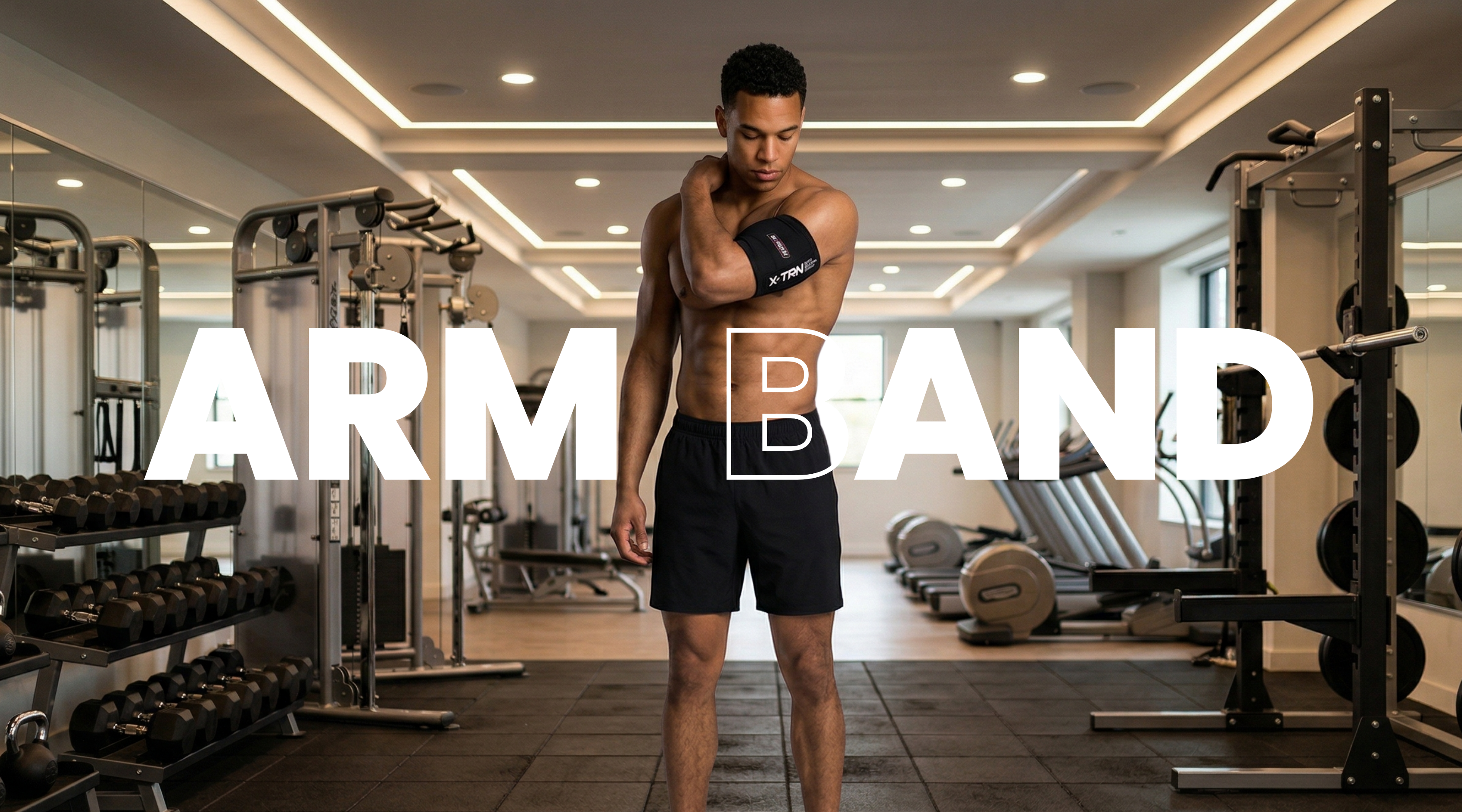Male athlete wearing X-TRN arm band during gym workout for arm support and performance training